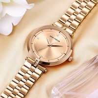 Montre à quartz pour femme avec cadran rond, bracelet en métal, marqueurs décoratifs en cristal, montre-bracelet analogique minimaliste pour un usage quotidien