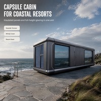 Cabane préfabriquée portable en forme de capsule avec fenêtres en verre teinté et murs isolés pour une utilisation en jardin et en station balnéaire