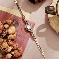 Montre-bracelet compacte de luxe pour femme, style américain NYY, avec cadran ovale décoratif en verre orné de diamants colorés, en alliage, pour étudiantes