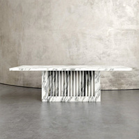 Table à manger en marbre sculpté avec base à rainures, style minimaliste, pour décoration intérieure haut de gamme