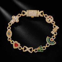 Bracelet Hip Hop multi-breloques en cuivre incrusté de zircone cubique, avec pendentifs cœur, bonbon et œil, chaîne style Iced Out Bling, bijoux unisexe, vente en gros