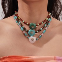 Collier pour femme style bohème avec perles abacus rondes plates en pierre naturelle, œil turc porte-bonheur et cœur incrusté de diamants et de zircons