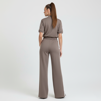 Ensemble de survêtement pour femme à manches courtes, veste courte zippée, pantalon de survêtement à jambes larges avec rayures latérales et boutons-pression, vente en gros