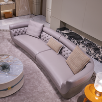 Canapé en cuir de luxe italien au design original, lignes droites, avec pieds en acier inoxydable et rembourrage en éponge