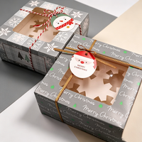 Boîte à gâteau en carton blanc festif et coloré, motif bonhomme de neige de Noël avec fenêtre découpée, pour présentation de pâtisserie de comptoir de fêtes