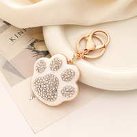 Nouveau porte-clés pendentif gland de sac mignon, style européen et américain, avec motif patte d'ours de dessin animé brodé et strass, article de mode créatif