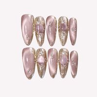 Faux ongles à presser en acrylique transparent rose nude effet œil de chat, forme amande, avec cadre doré transparent et strass ovales roses, 10 pièces pour rendez-vous