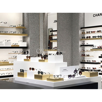 Présentoir optique fonctionnel de vitrine d'affichage de lunettes de stratifié de verre de conception de magasin optique professionnel