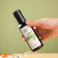 Bouteilles en verre rondes de 100ml bouteilles d'huile d'argan d'huile d'olive noire mate avec impression personnalisée bouteille d'huile de cuisson rechargeable avec verseur