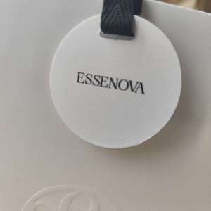 Essenova Luxury White Paper <b>Bag</b> With Embossed Logo Ribbon Handle Recyclable Cosmetic Packaging - Product Image 6