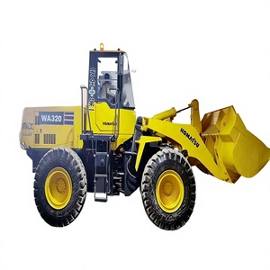 Petit tracteur avec chargeur frontal d'occasion Komatsu 320 - Product Image 1
