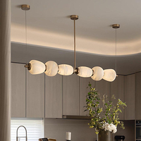 Lustre en marbre d'albâtre espagnol de luxe haut de gamme en cuivre, design moderne et minimaliste, longue bande, pour salle à manger, bar, réception