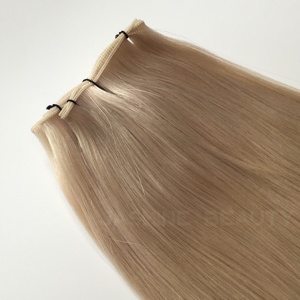 ผมต่อแบบเวอร์จินรัสเซียแท้ เกรด 60a ชนิด Genius Weft สีบลอนด์อ่อน  บางเฉียบ ไร้รอยต่อ น้ำหนัก 100 กรัม  แบบ Double Drawn  ผมแท้ Remy - Product Image 3