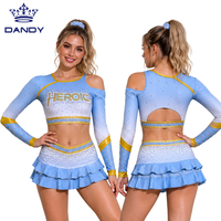 Ensemble d'uniformes de cheerleading personnalisés : Haut court à manches longues et épaules dénudées avec strass et jupe à volants pour la compétition