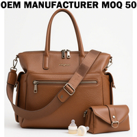 Sac à langer multifonctionnel en cuir végétalien OEM convertible avec pochettes d'organisation et station de change