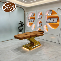 Table de massage électrique hydraulique pliable de luxe avec base en métal doré et extension incurvée personnalisée pour salon et salle de sport