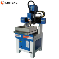Madera de hierro fundido de escritorio de 4 ejes de alta precisión 3030 4040 6040 6060 6090 pequeño enrutador CNC precio de la máquina de molde de Metal