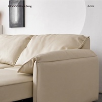 Canapé fonctionnel en cuir véritable Saffiano noir, style Bauhaus français, trois places, oreilles d'éléphant, nouveau modèle 2026, pour salon de villa, électrique