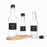 Récipient transparent de 3oz 5oz 8oz Bouteilles vides en verre pour sauce piquante Woozy au chili BBQ avec couvercle en plastique et film rétractable
