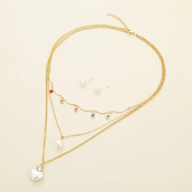 Hengyu vente chaude cuivre fille bijoux perle coeur pendentif chaîne coloré cuivre collier ensemble avec perle boucles d'oreilles