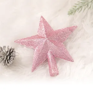 圣诞树顶部闪闪发光的粉红色星星闪粉装饰圣诞节节日装饰品