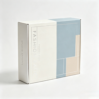 Boîte d'expédition en carton ondulé personnalisée avec motif géométrique coloré pour vêtements, accessoires et emballages e-commerce
