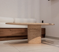MEUBLES JIAMEIJIA |   Table basse en forme de galet effet travertin avec base sur piédestal