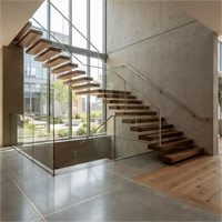 Escalier flottant à concept ouvert avec garde-corps en verre trempé, structure sur mesure, livraison directe d'usine