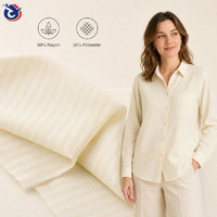 Tissu tissé texturé riche 68% rayonne 32% polyester 106GSM pour vêtements et robes féminines
