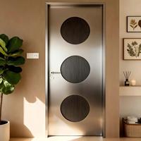 Porte intérieure moderne en acier inoxydable avec design métallique minimaliste et grilles décoratives rondes pour salon, chambre, hôtel et villa
