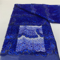 Tissu brodé de fleurs perlées pour robes de mariée et robes de soirée