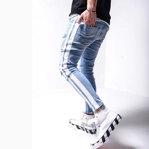 กางเกงยีนส์เดนิมทรงสกินนี่ขาดๆ แต่งซิปข้างสีน้ำเงินฟอก พร้อมแถบข้างสีขาว สำหรับผู้ชาย คุณภาพสูง ขายส่ง - Product Image 4