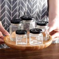 Toples penyimpanan kaca transparan, toples madu segi enam dengan tutup sekrup digunakan untuk madu dan gula botol kaca bening