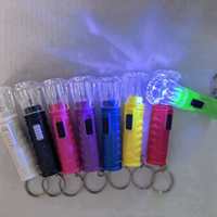 Mini-lampe torche électronique portable en forme de macaron, lumineuse, avec cordon, vente en gros.