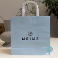 Sacs en carton bleu et blanc avec poignées, sacs d'emballage écologiques et biodégradables pour le shopping et les vêtements, avec logo personnalisé disponible.