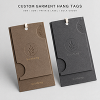 Étiquette de vêtement en papier multicouche personnalisée avec gaufrage à chaud et cordon pour l'image de marque des vêtements