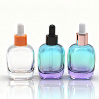 Vente en gros de flacons en verre ronds bleus dégradés de 50 ml - Contenant vide pour huile essentielle avec logo personnalisé et compte-gouttes en caoutchouc