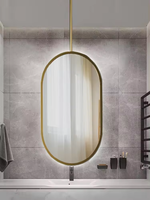 Miroir mural en verre avec cadre en aluminium de forme ovale au design de luxe Miroir de courtoisie mural désembué à commande tactile avec lumière LED