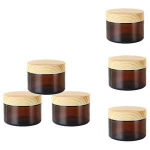Custom Logo 5g-100g Empty <b>Amber</b> <b>Glass</b> Eye & Face Cream Lotion Jars with Bamboo Lid for Cosmetic Skin Care Packaging - Product Image 1