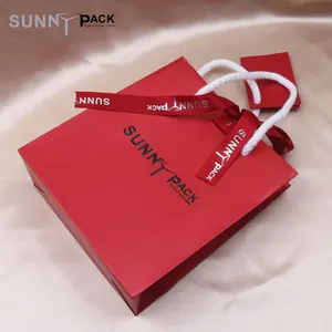 Factory direct small gift jewelry shopping red paper jewellery bag with tie ribbon bow and rope handle