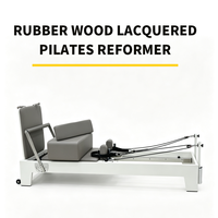 Reformer de Pilates en bois massif peint avec coussin en cuir PU haute densité pour l'entraînement de Pilates en studio ou à domicile