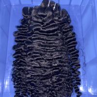 Prix d'usine de vente en gros Paquets de cheveux bouclés Mèche de cheveux humains vierges brésiliens Remy Mèche de tissage Extension de cheveux en gros