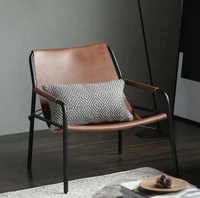 Fauteuil lounge en cuir pleine fleur tanné végétal, design danois moderne, pour projet hôtelier 5 étoiles, idéal pour salon.