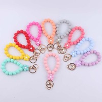 Porte-clés de perles rondes en silicone pour femme avec bracelet élastique coloré de fleur et pendentif à breloque de sac cadeau imprimé UV