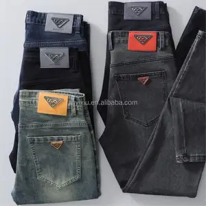 Venta al por mayor de alta calidad nuevos pantalones vaqueros casuales con tachuelas para hombre pantalones holgados traje punk rasgado para hombre