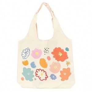 Bolso de playa de lona de algodón con tirantes y estampado floral, estilo camiseta sin mangas, para compras y excursiones, de moda y ecológico. - Product Image 1