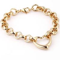Ensemble collier et bracelet tendance en acier inoxydable plaqué or avec pendentif cœur ajouré pour femme - Vente en gros
