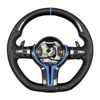 Volant en fibre de carbone pour BMW, disponible pour une personnalisation haut de gamme. Parfait pour votre propre véhicule ou comme cadeau haut de gamme.