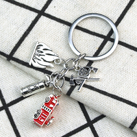 Porte-clés tendance en alliage de zinc en forme de croix de pompier, avec pendentif extincteur, hache et casque de pompier, accessoires pour pompiers