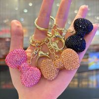 Porte-clés de luxe scintillant avec nœud en cristal, breloque de sac à la mode avec strass, pendentif décoratif pour voiture, cadeau d'anniversaire pour femme